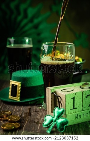 St Partick's day concept - beer, pot of gold, calendar, hat
