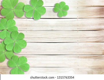 St. Patrick's Day Background with Green Shamrocks leaves on Wooden Texture