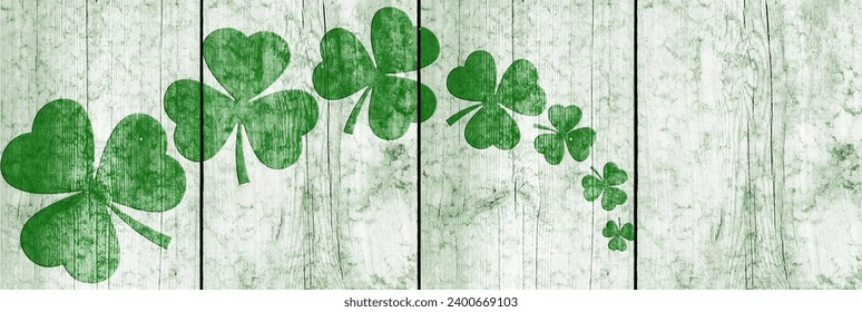 St Patricks day background. Shamrocks over a light green wood background. Decoration for St. Patrick's Day. Banner design - Powered by Shutterstock