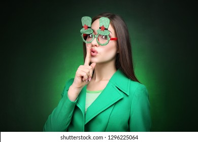 St. Patrick's Day. Beautiful woman wearing green glasses