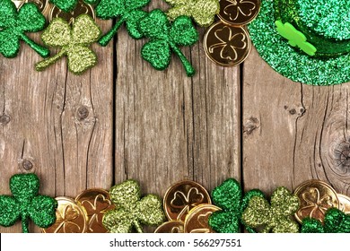 St Patricks Day Double Border Of Shamrocks, Gold Coins And Leprechaun Hat Over Rustic Wood