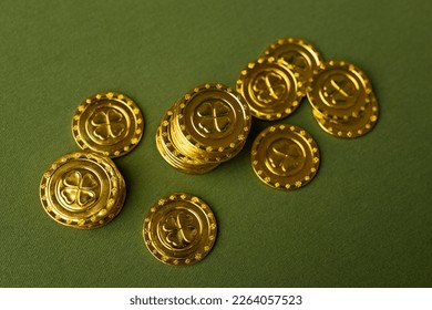 St. Patrick's Day Gold Coins on a green background. - Powered by Shutterstock