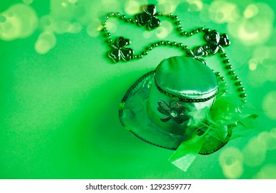 St Patricks Day green background with copy space. Concept of St Patricks Day with a green hat and shamrocks - Shutterstock ID 1292359777
