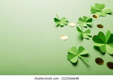 St. Patrick's Day. Green Background With Clover Leaves: Shamrock And Four-leafed, Coin Or Confetti. Copy Space. Paper Craft.