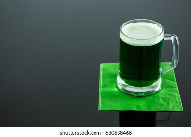 St Patricks Day green beer on napkin on glass surface - Powered by Shutterstock