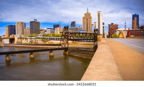 St. Paul City in Minnesota, skyline, skyscrapers, and St. Paul City Hall over the Robert Street Bridge and Mississippi River in the Upper Midwestern United States - Powered by Shutterstock