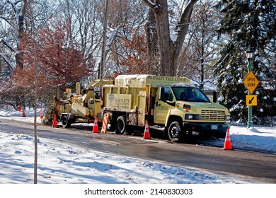 ST PAUL, MINNESOTA USA - DECEMBER 03, 2019: Truck For Shredding Winter Tree Trimming Surrounded By Orange Warning Cones For Safety.