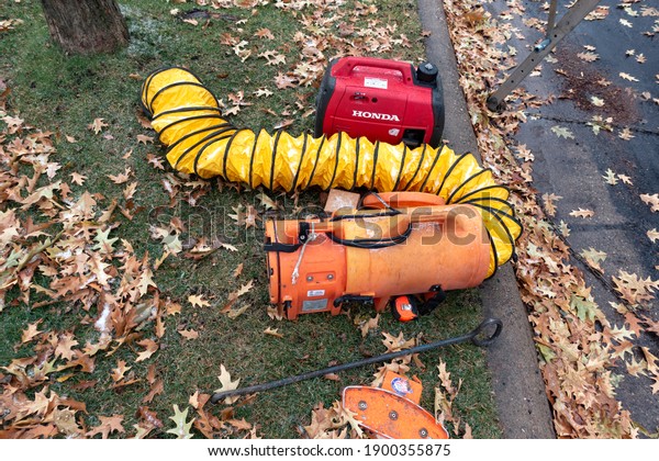 ST PAUL, MINNESOTA USA - NOVEMBER 10, 2020:\
Parts of a car vacuum cleaner or a large yellow caterpillar escaped\
from the nature center. 