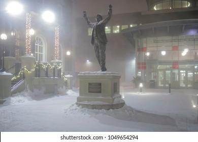 ST. PAUL, MN - JANUARY 2018 - A Statue Of Herb Brooks Of NHL Fame In Downtown St. Paul On A Snowy Winter Night