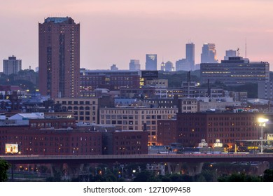 ST. PAUL, MN - JULY 2017 - A Telephoto Shot Compressing Architecture Of St. Paul With The Distant Minneapolis Skyline During Sunset