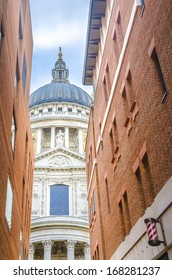 St Paul's Cathedral between brick buildings, London, England - Stock Image