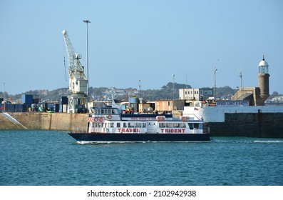 ST PETER PORT, UNITED KINGDOM - Aug 10, 2019: A Travel Trident ferry boat bringing passengers from Herm Island to St Peter Port, Guernsey, a British crown dependency in the Channel Islands 
