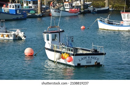 ST PETER PORT, UNITED KINGDOM - Aug 10, 2019: A small fishing boat moored in the harbour at St Peter Port, Guernsey, a British crown dependency, in the Channel Islands 