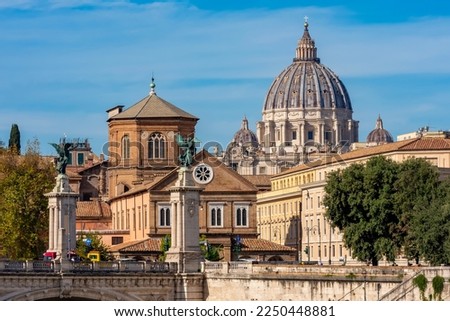 St. Peter's basilica dome in Vatican seen from Tiber river embankment, Rome, Italy