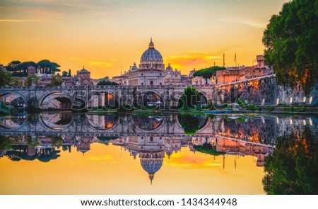 St. Peter's basilica in Rome,Vatican, the dome at sunset with reflection