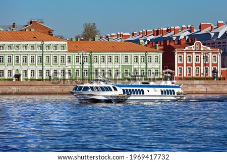 St. Petersburg. High-speed passenger hydrofoil ship of the Meteor series on the Neva River on a sunny spring day. Bright cityscape. River cruises and travel