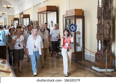 ST. PETERSBURG - JUNE 30, 2011: A group of unidentified tourists have a guided tour in the Hermitage, the biggest in Russia. To see all the displays one should walk 20 kilometers.