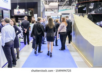 St. Petersburg, Russia - 2 October, 2019.
A crowd of people between the stands.
Participants and visitors of the annual St. Petersburg Gas Forum.