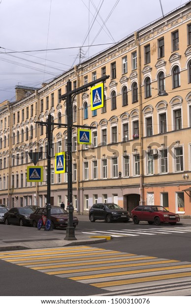 St. Petersburg, Russia. 7 Aug 2019.\
Pedestrian crossing the Old street of the\
city.