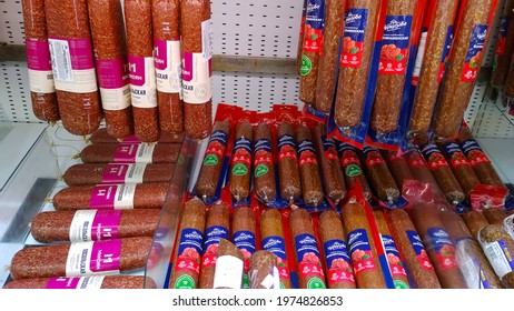 St. Petersburg, Russia - April 18, 2021: Smoked Sausage, Salami, Lunch Meat Products On Supermarket Shelves. Retail Industry And Chain. Grocery Store. Food. Product Of Meat Packing Industry. Eating