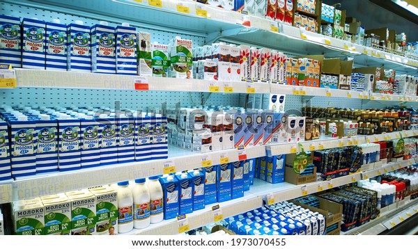 St. Petersburg, Russia - April 18, 2021: Top\
Russian Supermarket is one of largest players of retail industry in\
Russia. Shelves with dairy products, yogurt, milk. Discount price.\
Grocery store. Aisle