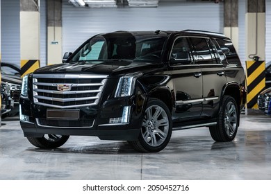 St Petersburg, Russia - August 28, 2021: Cadillac Escalade IV Front View, Three Quarters View, Headlight On