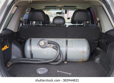 ST. PETERSBURG, RUSSIA - AUGUST 28, 2014: The Installation Of A Gas Cylinder For Liquefied Petroleum Gas (LPG) In The Trunk Of A Car