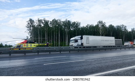 St. Petersburg, Russia - August 3 2019: Landing a medical helicopter on the highway after a car accident with wounded people and death. Aero-medical evacuation units or air ambulance