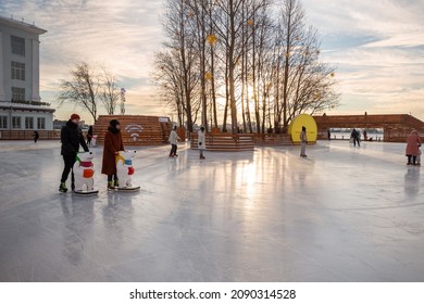 St. Petersburg, Russia - December 10, 2021: Public outdoor ice skating rink in Sevkabel Port. People ice skating, active lifestyle