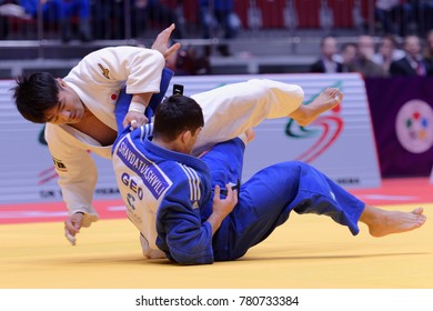 ST. PETERSBURG, RUSSIA - DECEMBER 16, 2017: Final Fight Soichi Hashimoto, Japan (white) Vs Lasha Shavdatuashvili, Georgia During Judo World Masters Tour. Hashimoto Won Gold Medal