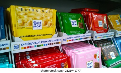 St. Petersburg, Russia - February 11, 2022: Shelves With Various Famous Brand Chocolate Ritter Sport. Candy With Nuts. Aisle In Supermarket. Promotion. Retail Industry. Grocery Store. Local Market.