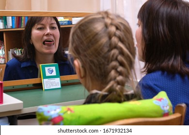 St. Petersburg, Russia - February 27, 2020: A Speech Therapist Specialist Conducts Speech Correction Classes In A Children's Preschool Specialized Institution. The Correct Pronunciation Of Sounds