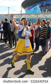 ST. PETERSBURG, RUSSIA - JULY 03, 2018: Swedish football fan before the game with teams of Sweden and Switzerland on the square near the Saint-Petersburg Stadium. FIFA 2018 World Cup in Russia