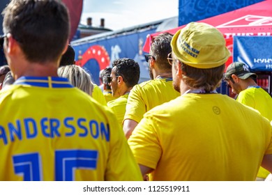 St. Petersburg, Russia - June 18, 2018: Supporters Of Sweden National Football Team Watching Game Match At Fan Festival. FIFA World Cup. Swedish Fans Men, Back View. People, Crowd. 