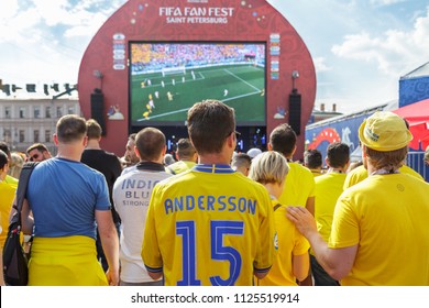 St. Petersburg, Russia - June 18, 2018: Supporters Of Sweden National Football Team Watching Game Match On Large Screen At Fan Festival. FIFA World Cup. Swedish Fans, Back View. People, Crowd. 