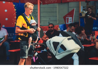 St. Petersburg, Russia - June 18, 2018: Swedish Family Supporting Of Sweden National Football Team In Fanzone Before Game. Dad Holding Child In Baby Carrier Backpack. Man In Kit With Kid In Panama. 