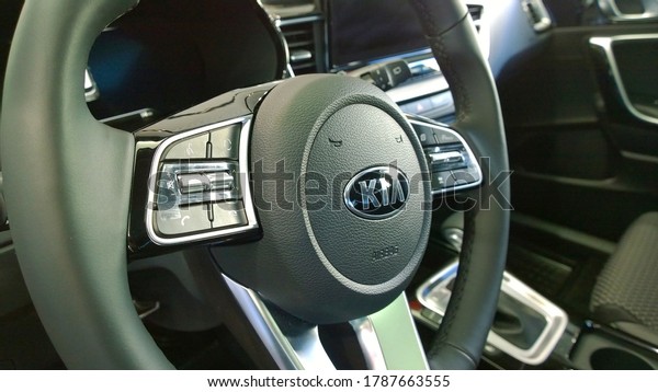 St. Petersburg, Russia - June 20, 2020: Steering\
wheel of new Kia. Auto interior. Car dealership. Vehicle local\
distribution. Official automobile dealer. Insurance. Automotive\
industry. Speed concept.