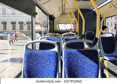 ST. PETERSBURG, RUSSIA - MARCH 28, 2018: Bus Interior with Empty Seats on Sunny Day. Public Transport Service, City Bus Inside with No Passengers. Modern Transportation Coach Bus in the Inside View.
