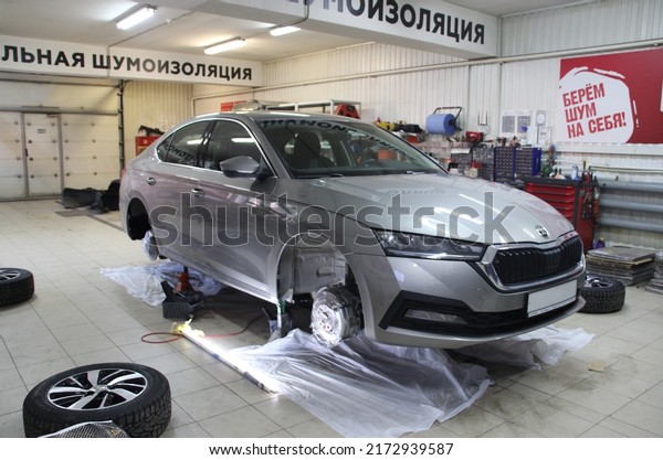 St. Petersburg, RUSSIA - May 14, 2022 Sound\
insulation of cars. Two-component, vibration damping mastic\
Standardplast noise liquidation, is designed for sound insulation\
of car wheel arches.