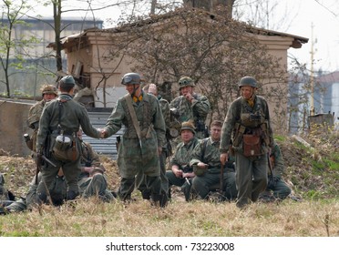 ST. PETERSBURG, RUSSIA - MAY 9: Unidentified men reproduce the battle between the Soviet and Allied Armies against Fascist Forces on May 9, 2010 in Shlisselburg Fortress, St. Petersburg, Russia.