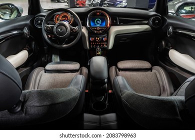 St Petersburg, Russia - November 22, 2021: MINI Hatch Cooper S III F55 F56 Restyling Vehicle Interior, Steering Wheel, Badge, Front Seats, Central Console Panel, Shift Knob, Dashboard, Windshield