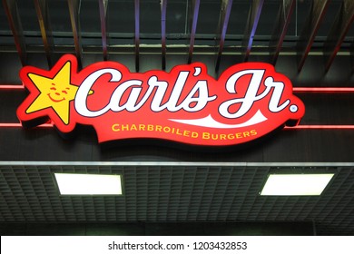 ST. PETERSBURG, RUSSIA - OCTOBER 11, 2018: Carl's Jr. Fast Food Restaurant Logo. Close Up View Of Carl's Jr. Burger Joint Brand Logo. Carl's Jr. Is World Famous American Fast Food Restaurant Chain