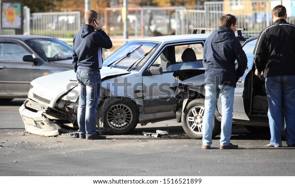 St. Petersburg  Russia  October 12, 2013\
clash of\
two cars at the crossroads, unrecognizable people stand near\
crashed cars