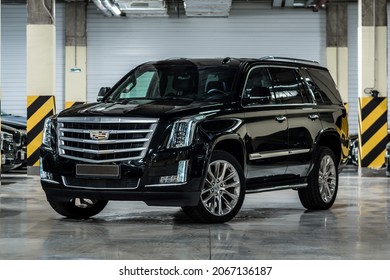 St Petersburg, Russia - October 17, 2021: Cadillac Escalade IV Front View, Three Quarters View, Headlight On