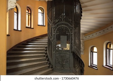 St. Petersburg, Russia - October 25, 2014: The main staircase round interior with forged door of an elevator shaft