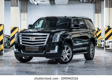 St Petersburg, Russia - October 31, 2021: Cadillac Escalade IV Front View, Three Quarters View, Headlight On