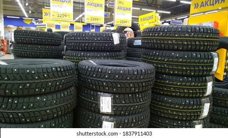 St. Petersburg, Russia - October 6, 2020: Stack Of New Studded Tires For Sale In A Supermarket. Discount. Professional Car Service And Repair Concept. Get Your Vehicle Wheel Ready For Winter And Snow 