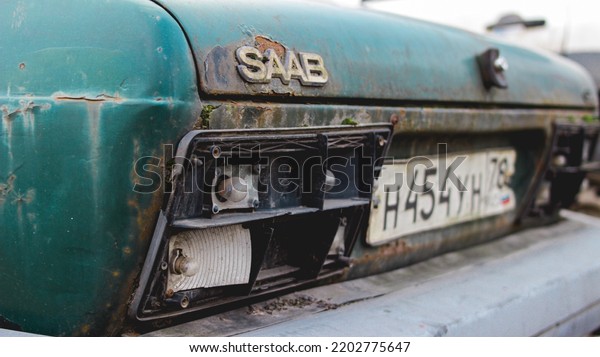 St. Petersburg, Russia -\
September 10, 2022: Chrome, rusty nameplate of a Saab car. A detail\
of a vintage Saab car. The logo of the Saab car on the trunk of the\
car.