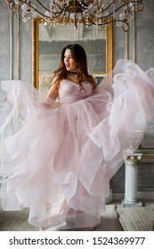 
St. Petersburg, Russia - September 25, 2019: A Beautiful Young Girl In A Lilac Dress, The Bride In An Unusual Way, Pace Lips Dancing And Waving A Dress. Rock And Roll And Wedding, Originality