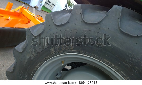 St. Petersburg, Russia - September 4, 2020: BKT Agrimax\
RT855 Radial Tractor Tire with reinforced bead. New modern wheel.\
Higher load capacity. Agricultural machinery. Farmer business.\
Manufacturing 
